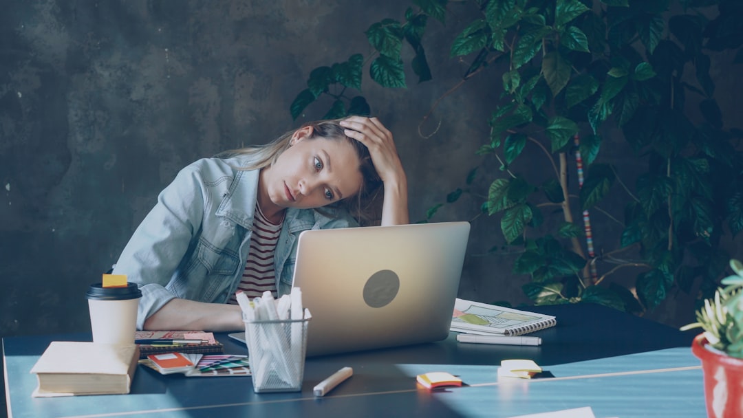 Woman depleted at desk — the science of why chronic stress wears you down